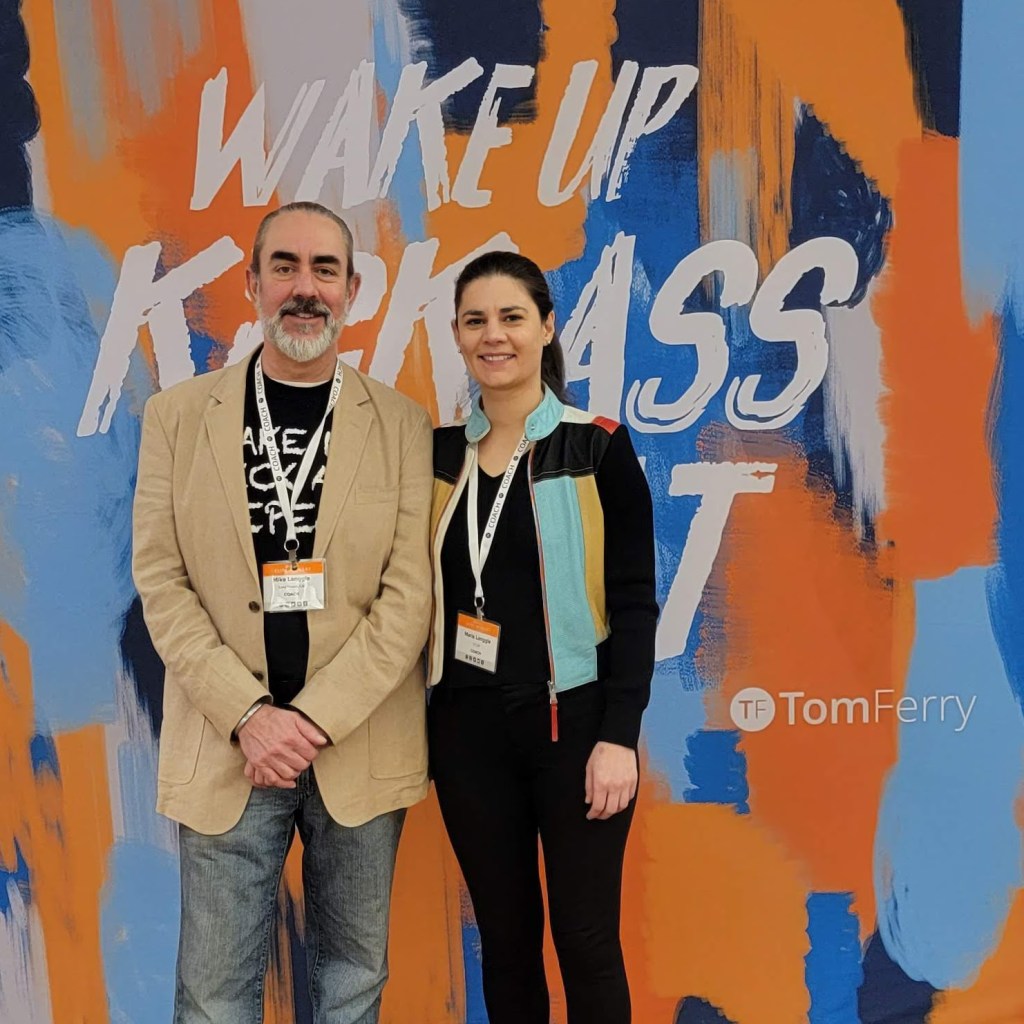 Mike and Maria Langgle together at a Tom Ferry coaching event